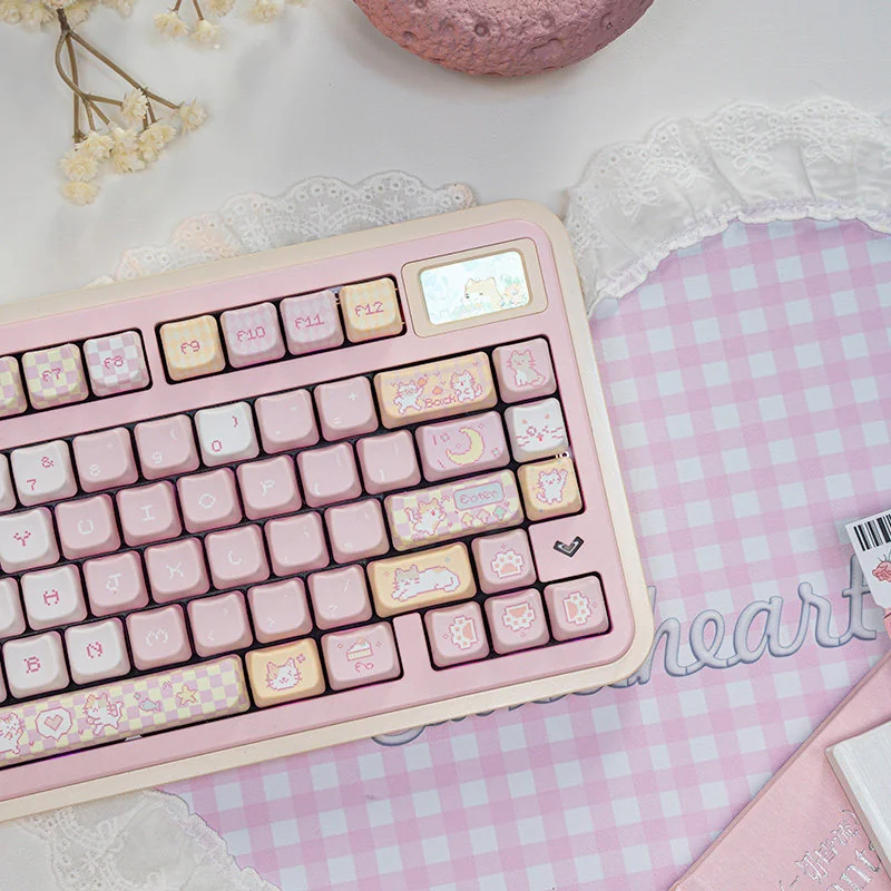 Detail shot of a Pixel Cat keycap, emphasizing its cute feline design and vibrant colors.