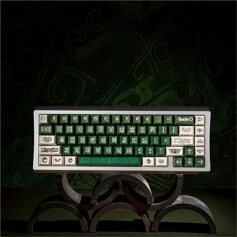 Ancient Bronze Keycap Set on a dark mechanical keyboard, showcasing the full layout and historical patterns.