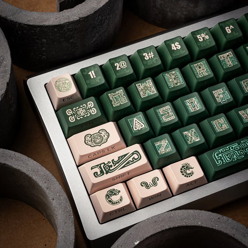 Detail shot of an OEM profile keycap from the Ancient Bronze set, showing its sculpted shape and side-printed legend.