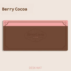 Berry Cocoa Desk Mat on a desk showcasing warm brown and pink tones