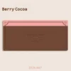 Close-up of Berry Cocoa Desk Mat, highlighting the cozy legends and fabric texture