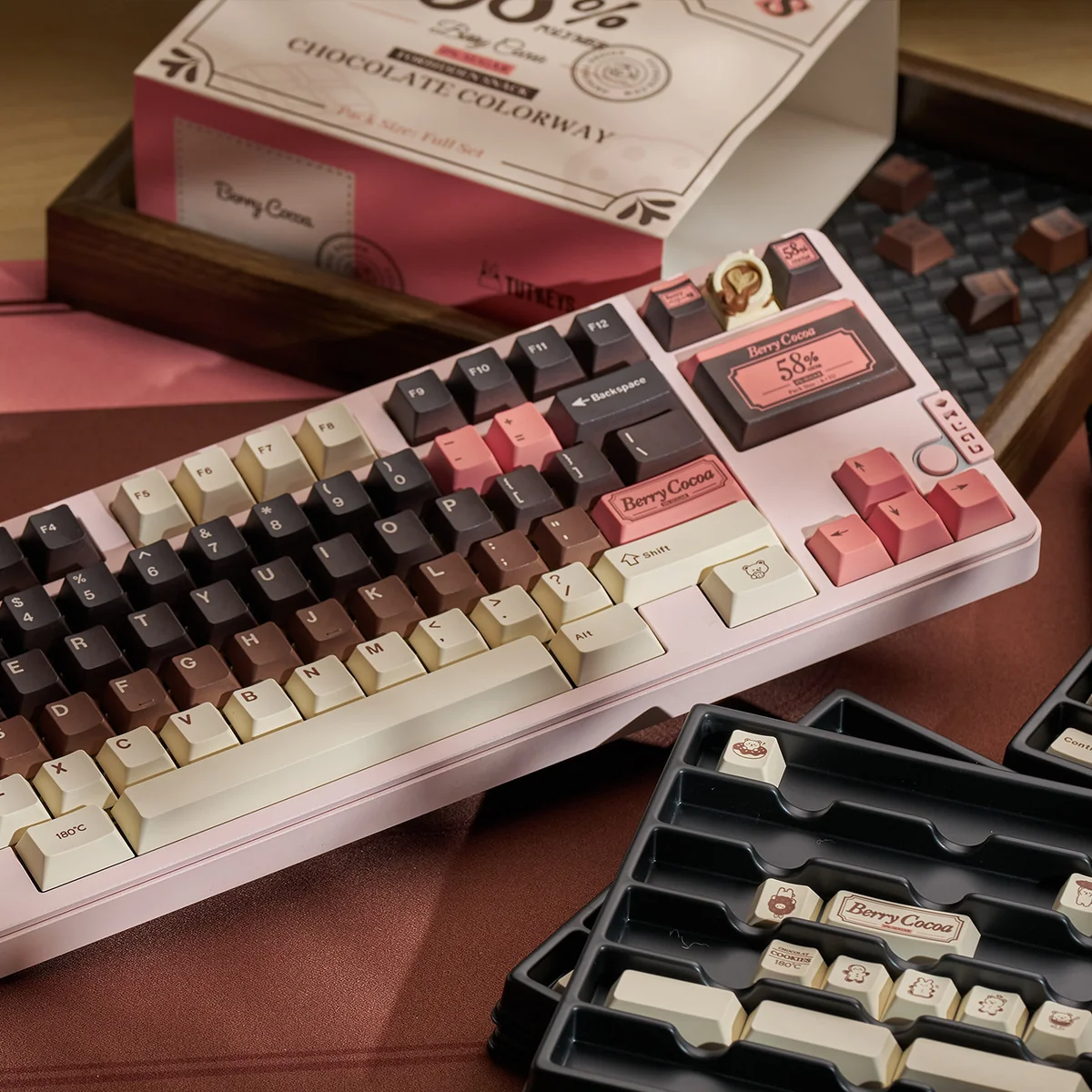 Detail of the Berry Cocoa keycaps, showing the inviting, dessert-inspired color palette.