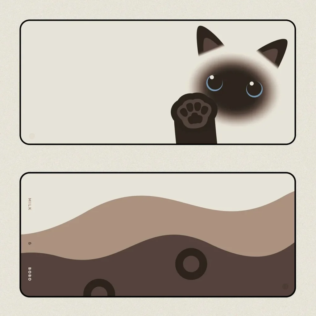 Boba & Siamese Cat Desk Mat on desk with cozy setup