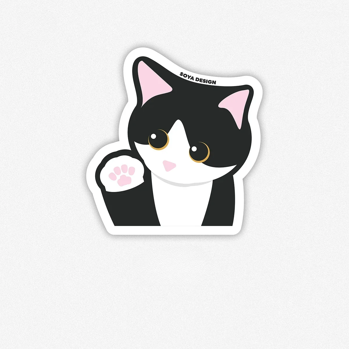 Close-up of Cow Cat themed mouse pad with black and white patterns
