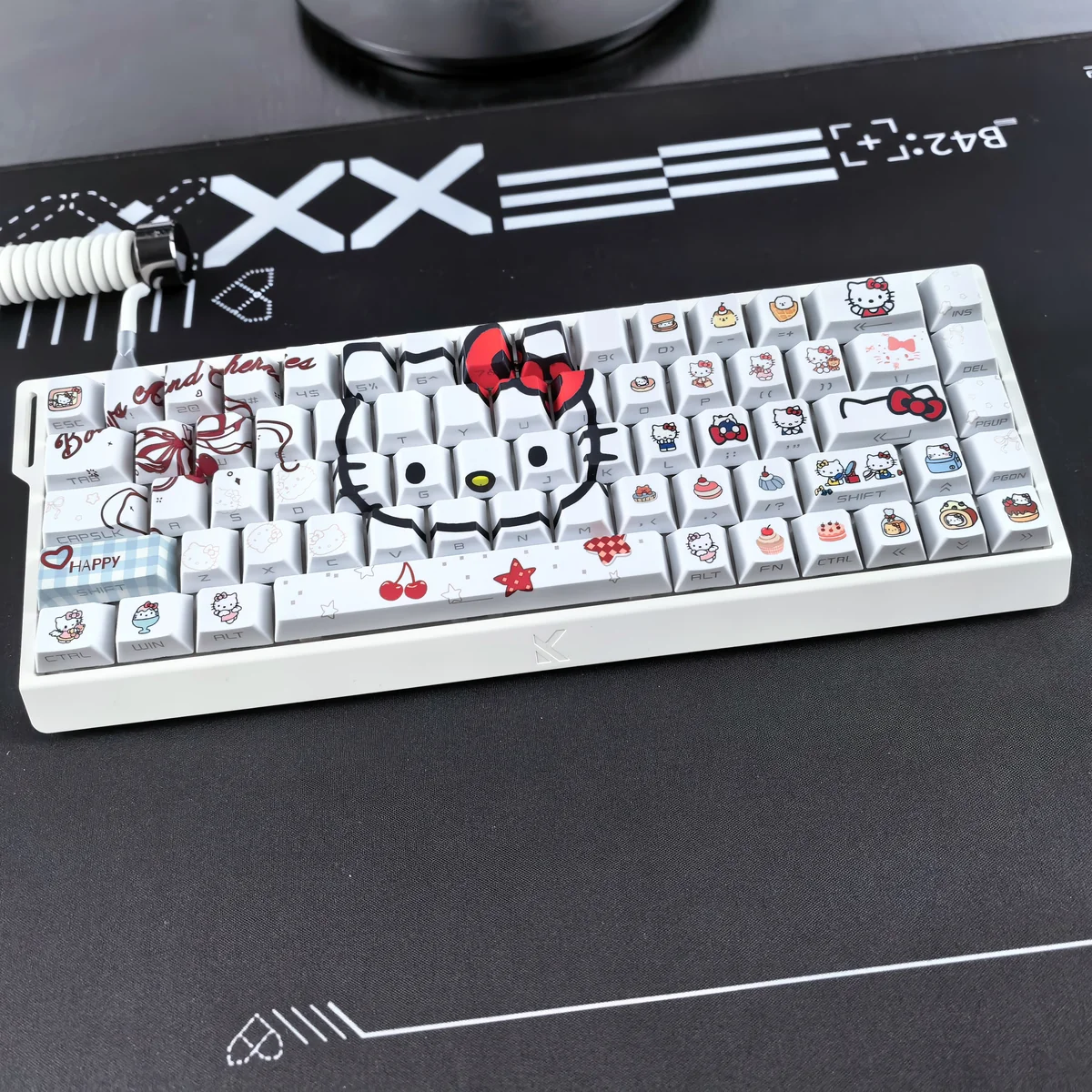 Close-up of Hello Kitty keycaps, highlighting the vibrant dye-sublimated designs and translucent legends.