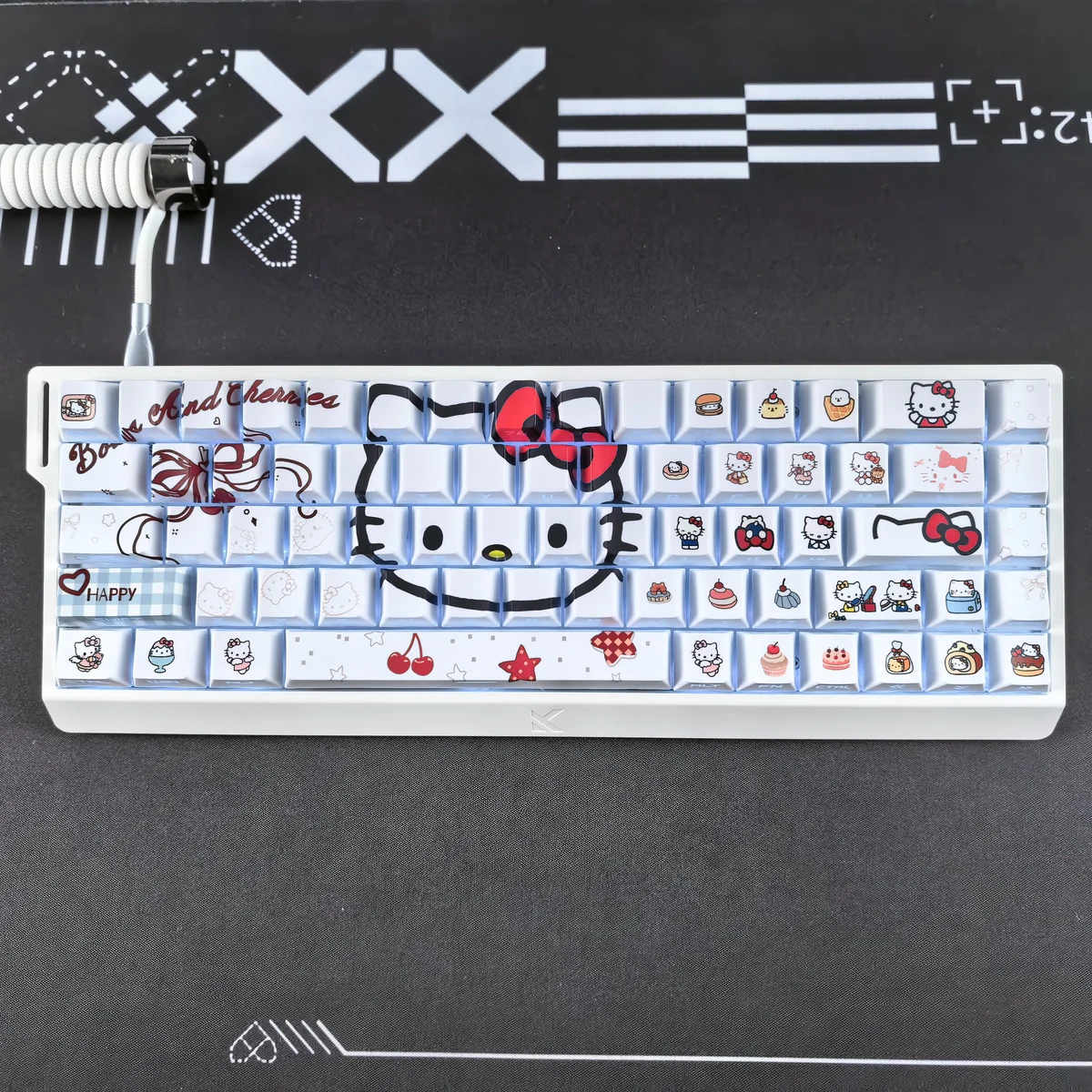 Angled view of the Hello Kitty keycap set, displaying the full layout and Cherry profile.