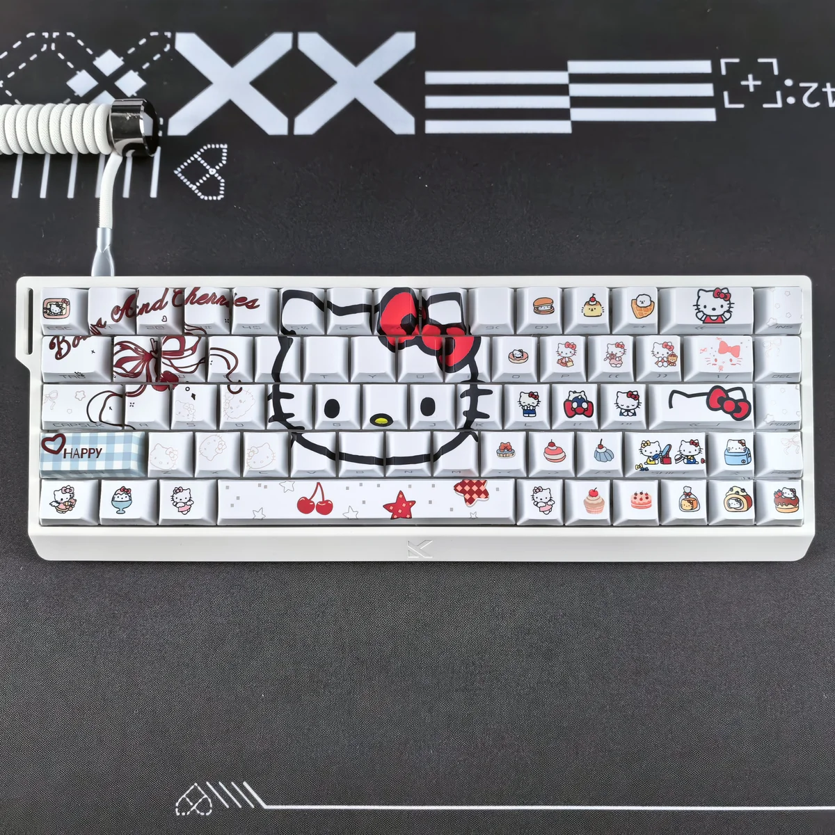 Hello Kitty PBT keycap set on a white mechanical keyboard, showcasing backlit legends.