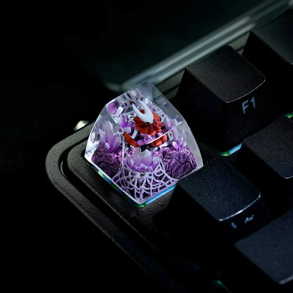 Hollow Knight Hornet keycap on a backlit mechanical keyboard