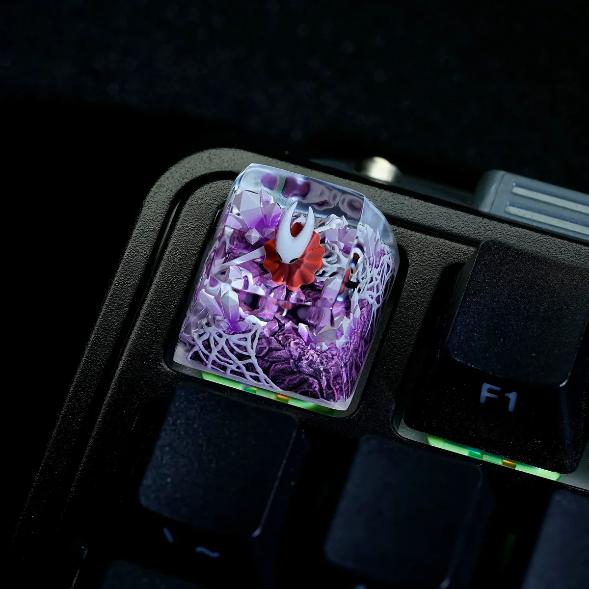 Close-up of hand-painted Hornet details on translucent resin keycap