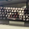 Close-up detail of a Man Jiang Hong keycap, showing the vibrant dye-sublimated calligraphy and PBT material.