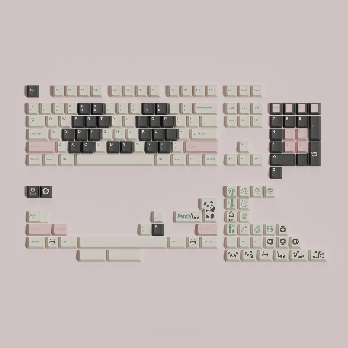Detailed shot of individual panda-themed keycaps and their milky gray color