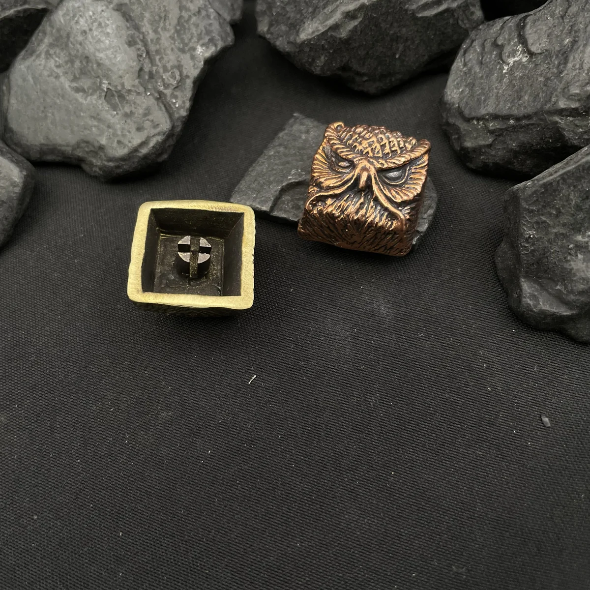 Detailed shot of the owl's textured feathers and wise eyes, crafted from pure copper.
