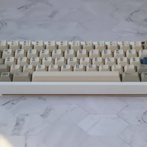 Olivetti PBT Keycap Set on a mechanical keyboard, showcasing vintage gray and white keycaps with Cherry profile.