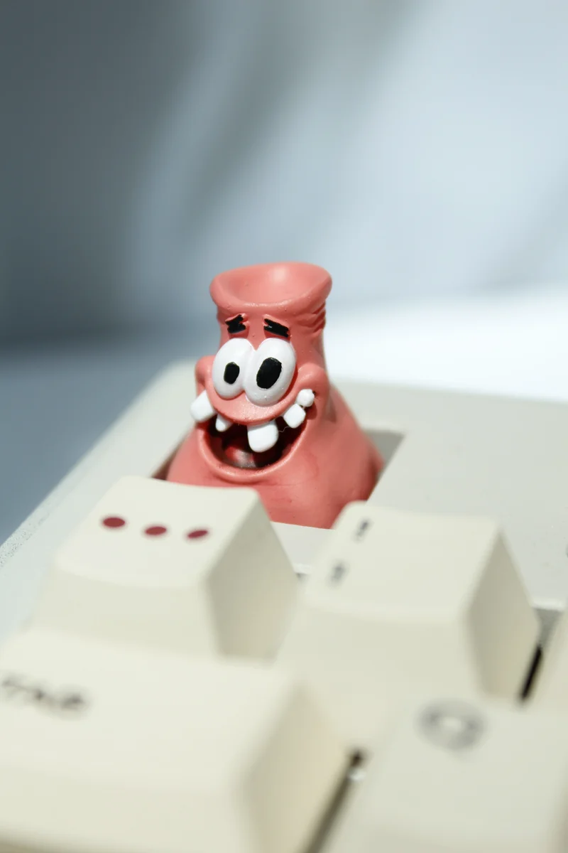 Close-up of the detailed, hand-painted Patrick Star Head-Bonked keycap