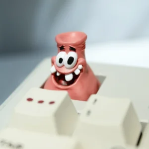 Handcrafted resin Patrick Star Head-Bonked artisan keycap on a mechanical keyboard