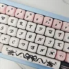 Close-up of PBT dye-sublimated black cat keycap design