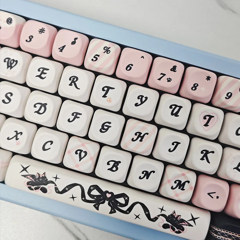 Close-up of PBT dye-sublimated black cat keycap design