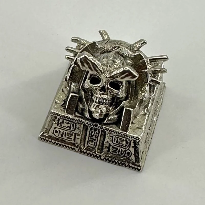 Angle view of Pharaoh Punk Skull Keycaps Handcrafted copper showing color layering and layout presence