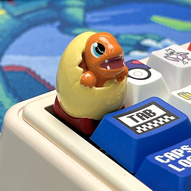 Close-up of a Pokemon hatching resin keycap, highlighting the detailed craftsmanship and smooth finish.