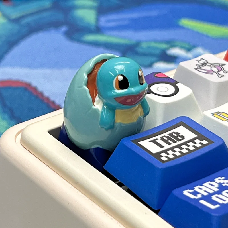 Collection shot of all three Starter Pokemon hatching keycaps, ready to adorn a mechanical keyboard, emphasizing their unique artisan appeal.
