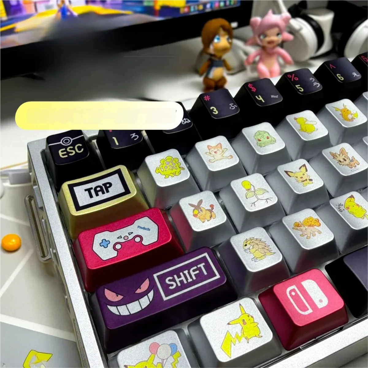 Close-up of a Pokemon character keycap showcasing the metallic finish and intricate details.