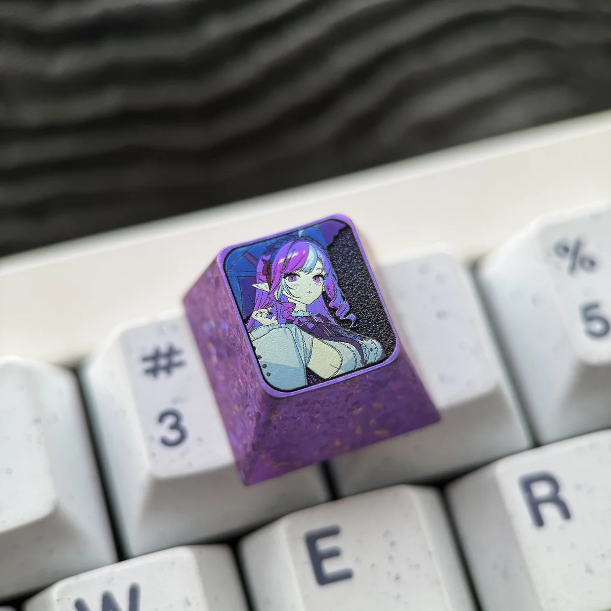 Titanium keycap showcasing polished metallic finish and durability
