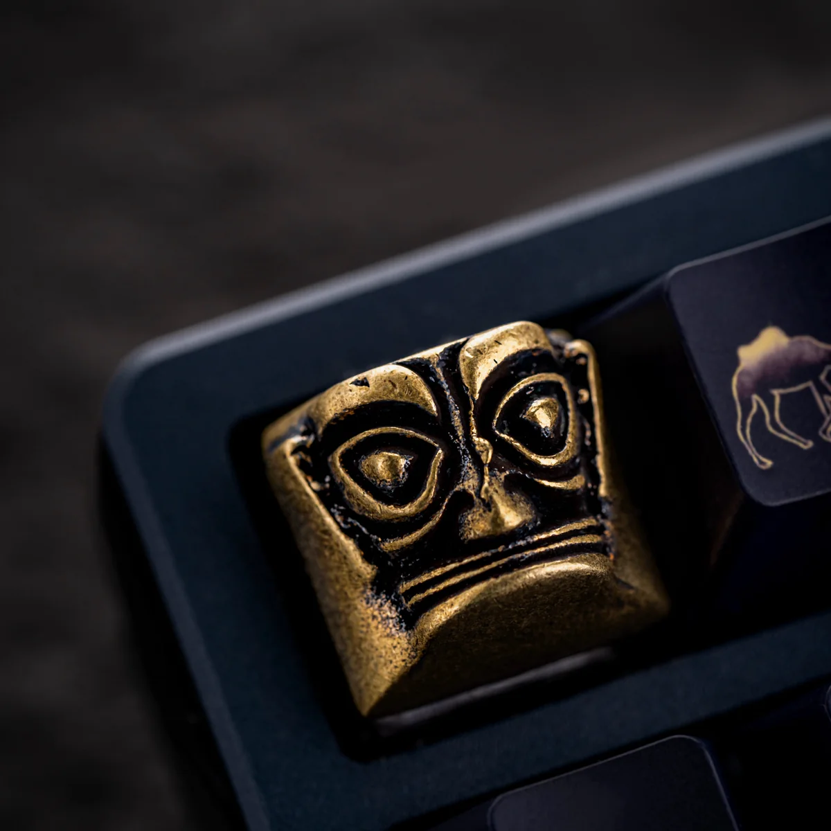 Sanxingdui mask elements fused with on a copper artisan keycap