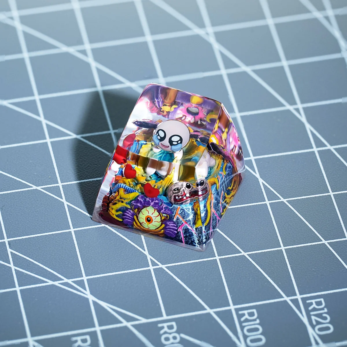 The Binding of Isaac keycap installed on a mechanical keyboard, accentuating its unique design as an ESC key.