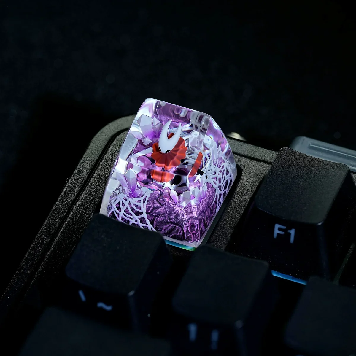 Hollow Knight Hornet keycap showcasing its translucent material
