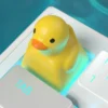 Yellow duck keycap installed on an ESC key of a gaming keyboard setup.