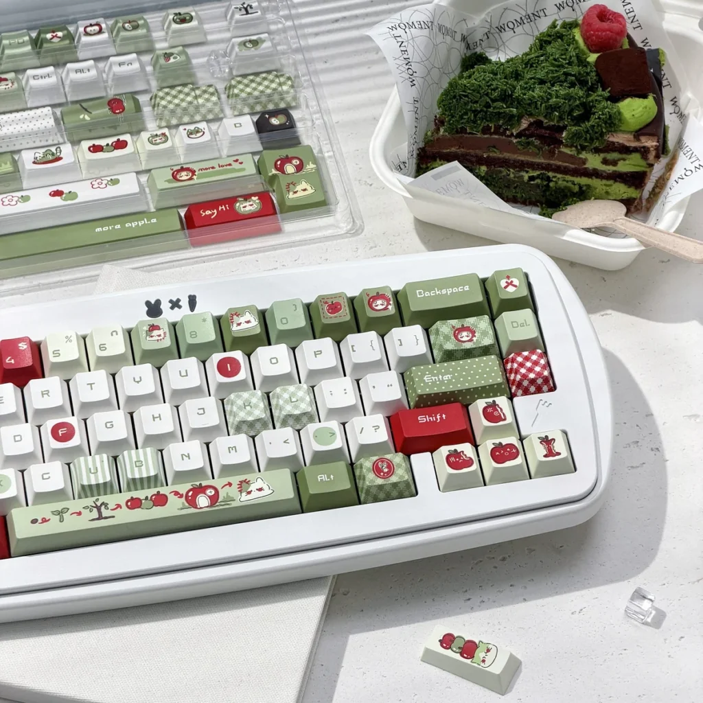 147-key apple keycap set arranged on a desk mat