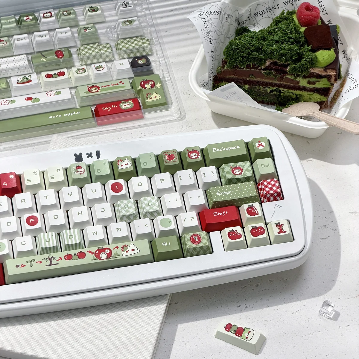 147-key apple keycap set arranged on a desk mat