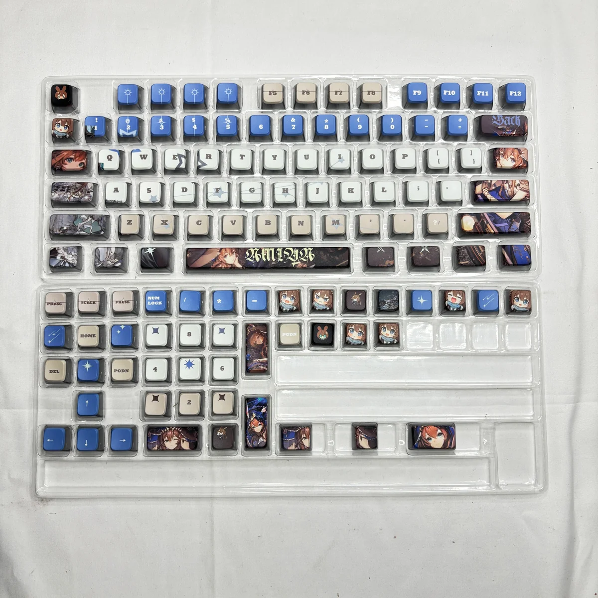Close-up of Arknights Amiya PBT MDA keycaps, highlighting dye-sublimated details and ergonomic profile