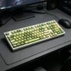 Jasmine Snow Bud keycaps installed on a keyboard with RGB backlighting, demonstrating the translucent legends' glow.