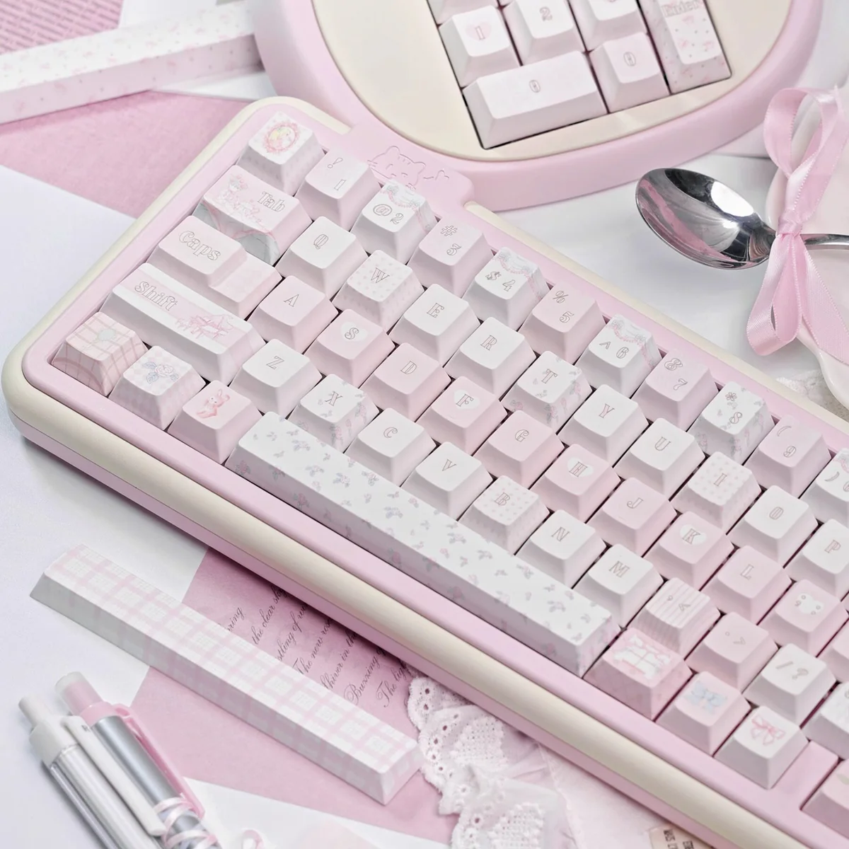 Close-up of Ballet Poetry Dye-Sub PBT Keycaps showcasing intricate ballet slipper and ribbon designs.
