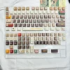 Angle view of Cassette Gentleman Cherry Keycap Unique showing color layering and layout presence