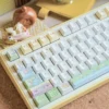 Close-up of playful cats fishing artwork on Cherry profile keycaps