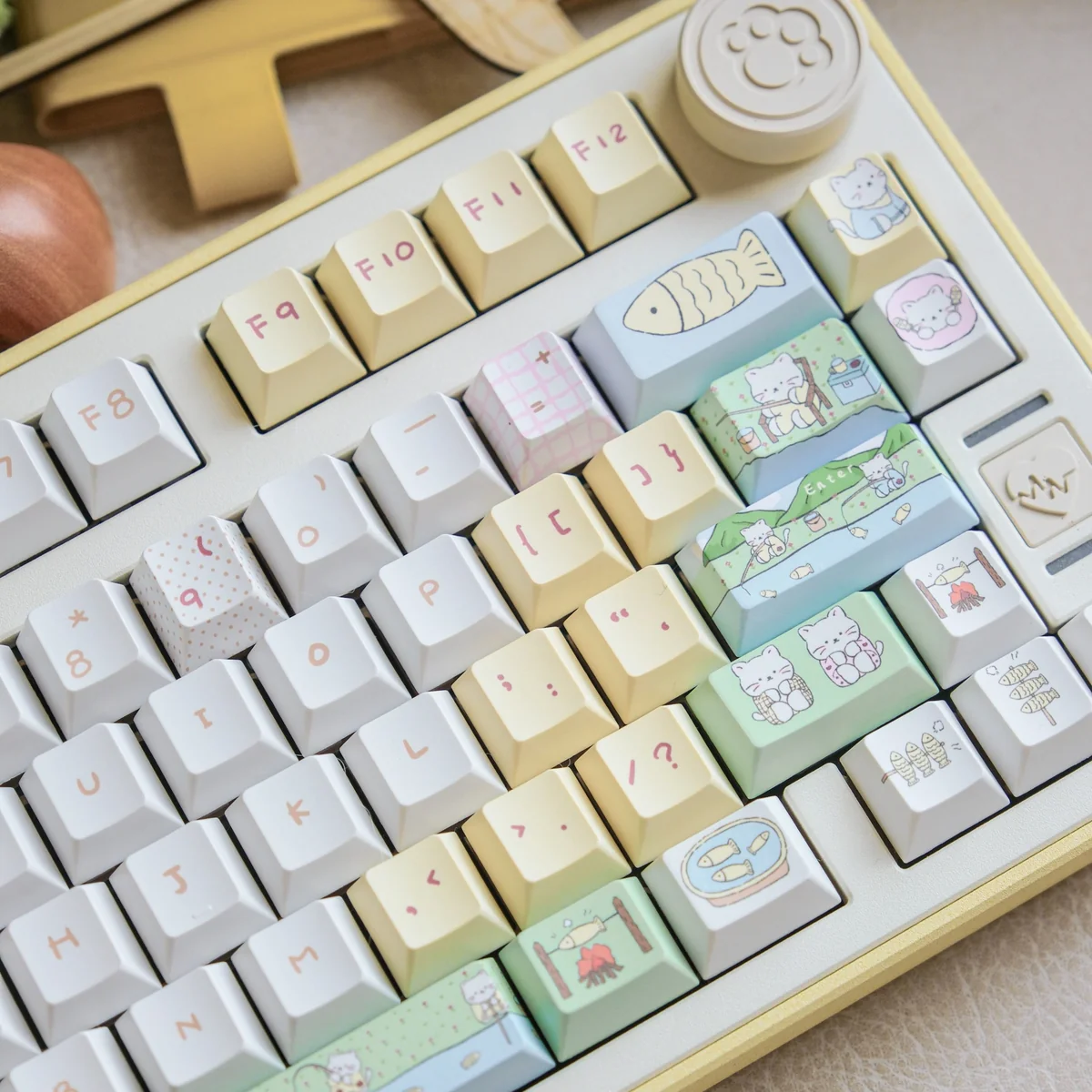 Cat Fishing keycap set shown in a pastel blue and white desk setup