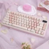 Cherry Blossom PBT MOA Keycap Set on a white mechanical keyboard, showcasing delicate pink floral design.