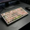 Side profile of Jasmine Snow Bud Cherry profile keycaps, showing their ergonomic sculpt and thick PBT walls.
