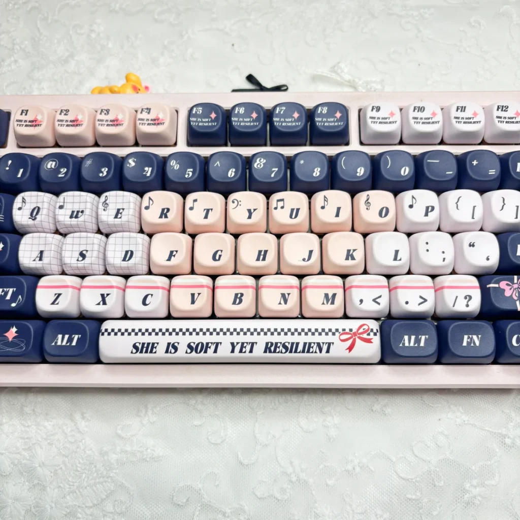 Blues Pink Voice keycaps installed on a white keyboard, illustrating the sophisticated color blend.