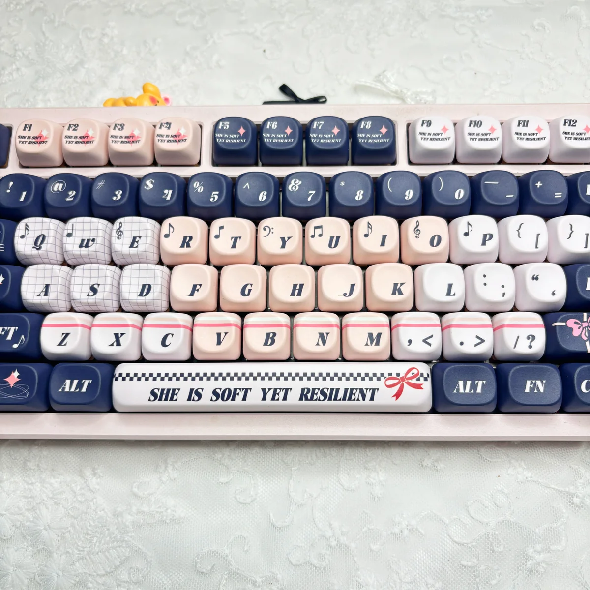 Blues Pink Voice keycaps installed on a white keyboard, illustrating the sophisticated color blend.