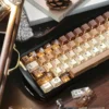 Lifestyle shot of a keyboard with Coffee Cat Keycap Set on a cozy desk setup