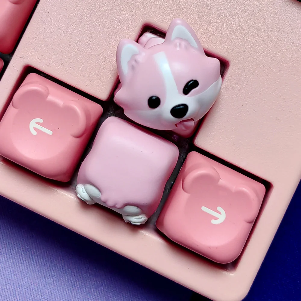 Adorable Corgi Butt Artisan Keycap in pink resin on a mechanical keyboard.