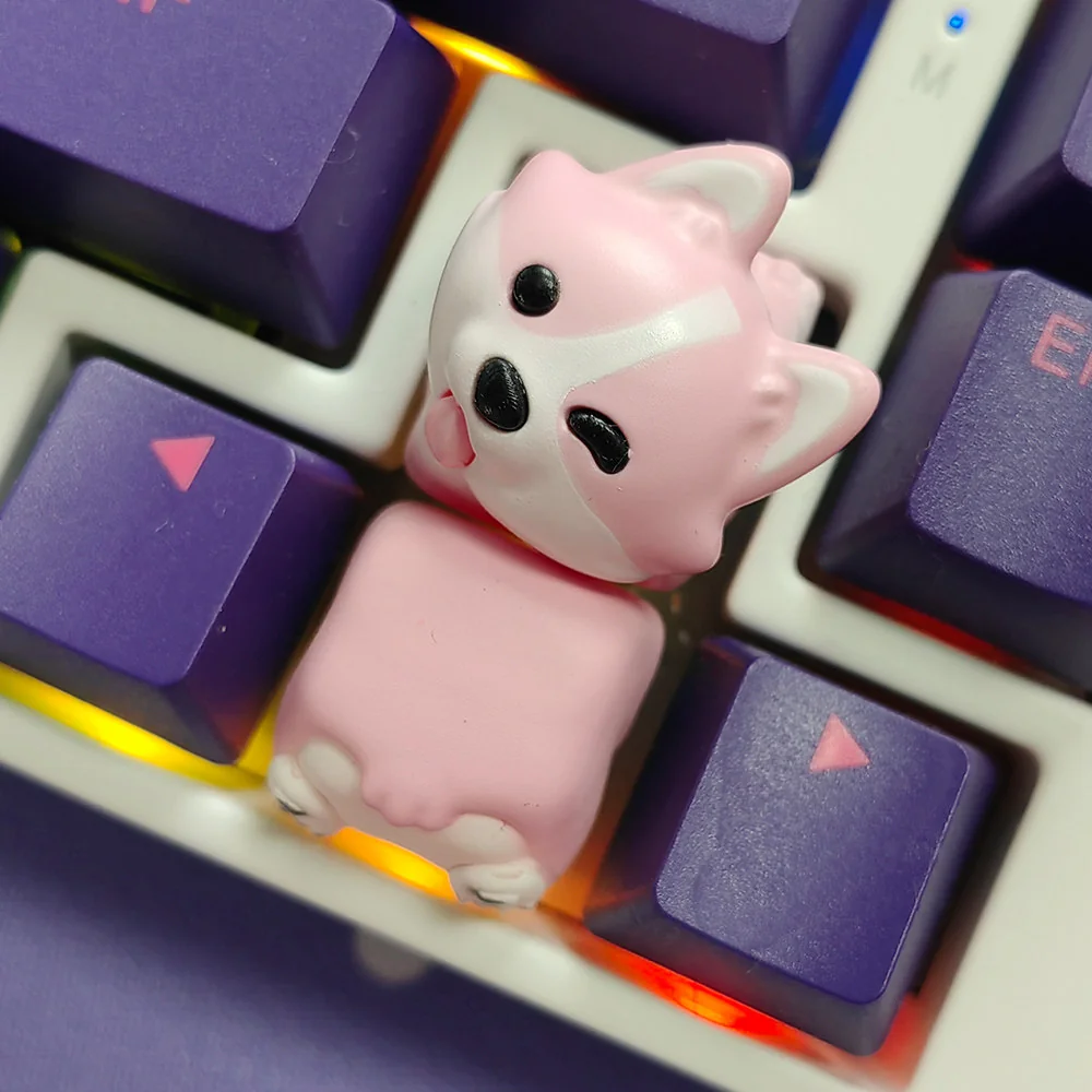Close-up of a hand-painted Corgi butt artisan keycap showcasing intricate details.