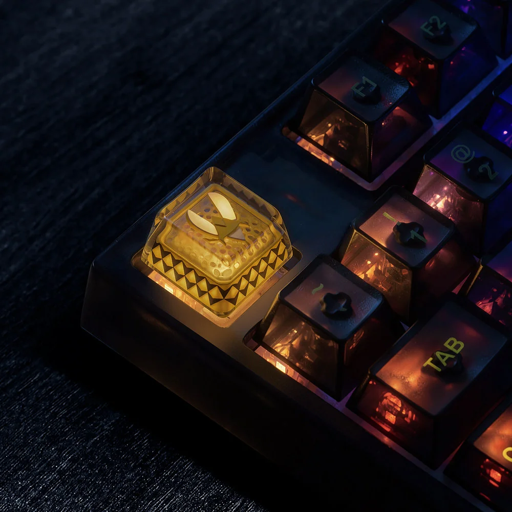 Close-up of backlit Team Vitality bee logo on artisan keycap