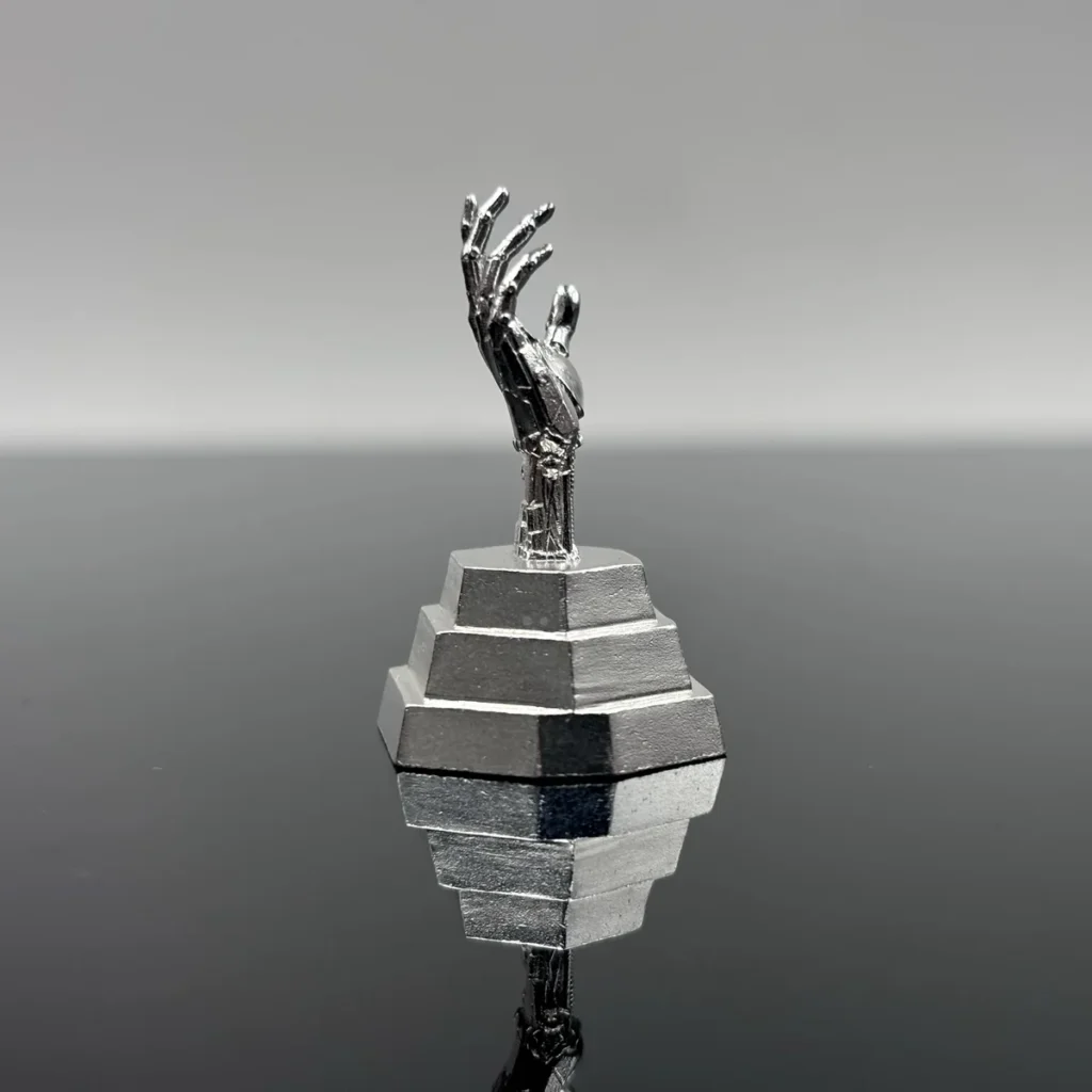 Side profile of Johnny Silverhand metal artisan keycap showing sculpt depth