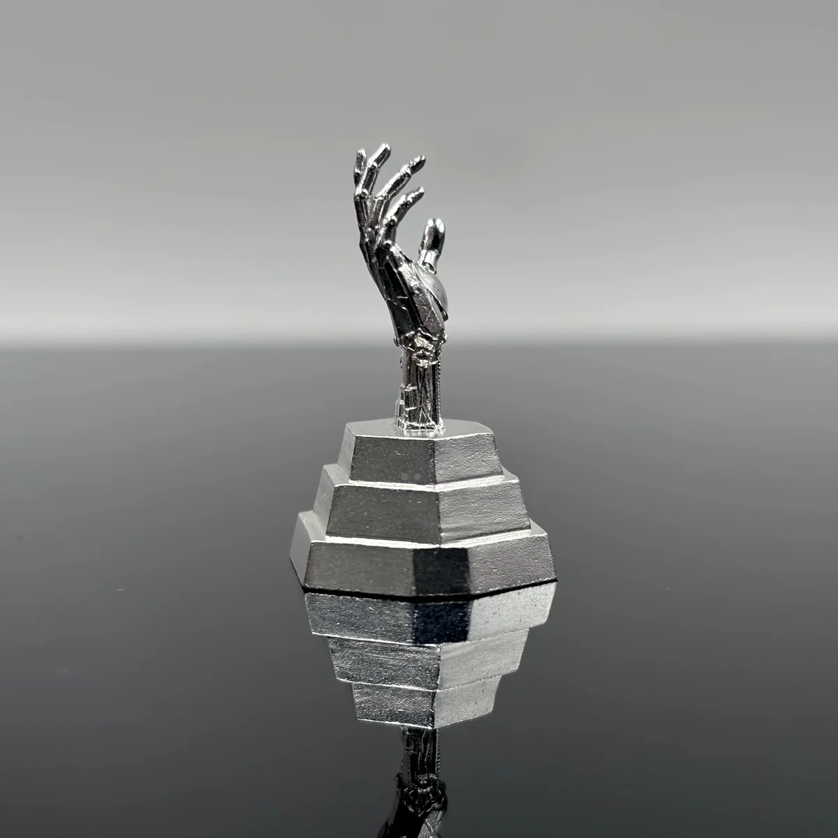 Side profile of Johnny Silverhand metal artisan keycap showing sculpt depth