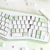 Cherry profile PBT keycaps from the Deep Forest Deer set arranged on a wooden desk