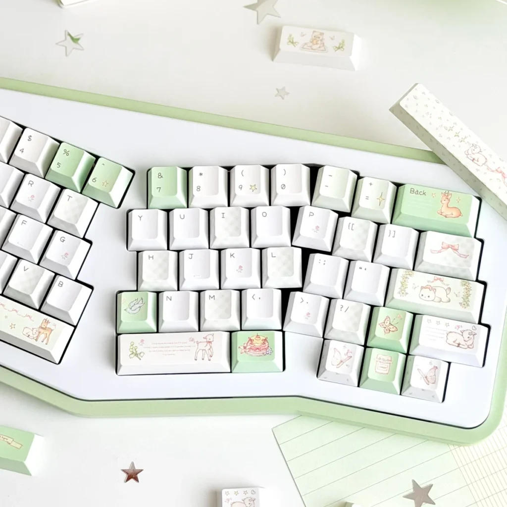 Cherry profile PBT keycaps from the Deep Forest Deer set arranged on a wooden desk